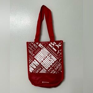 Lululemon red plastic shopping bag.